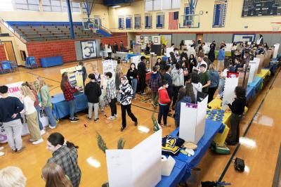 Student activities fair in our gym featuring 40+ teams, clubs, and activities